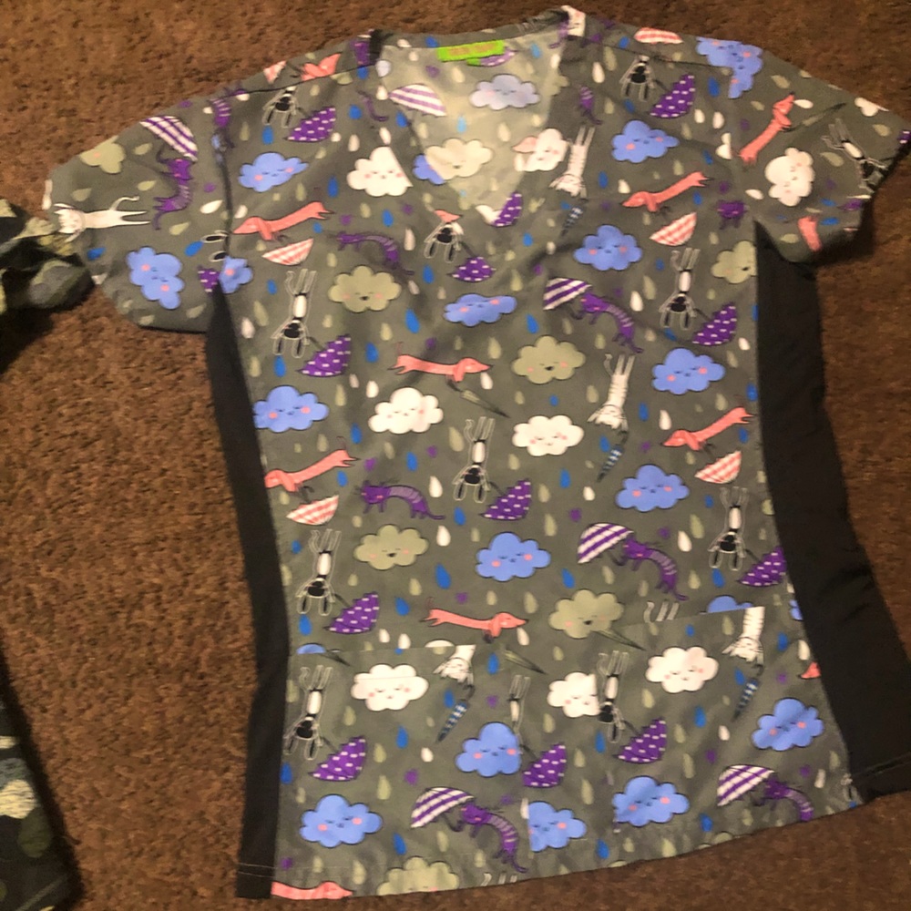 Unique grey scrub Top with literal raining cats and dogs designs on it